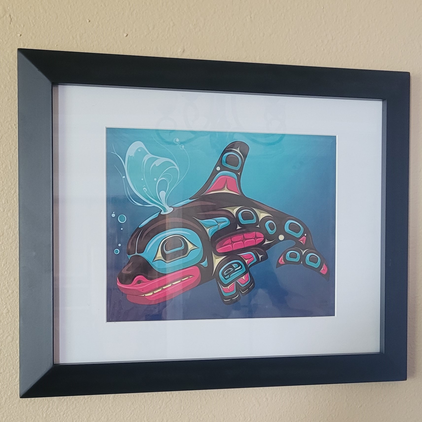 photo of a framed orca print